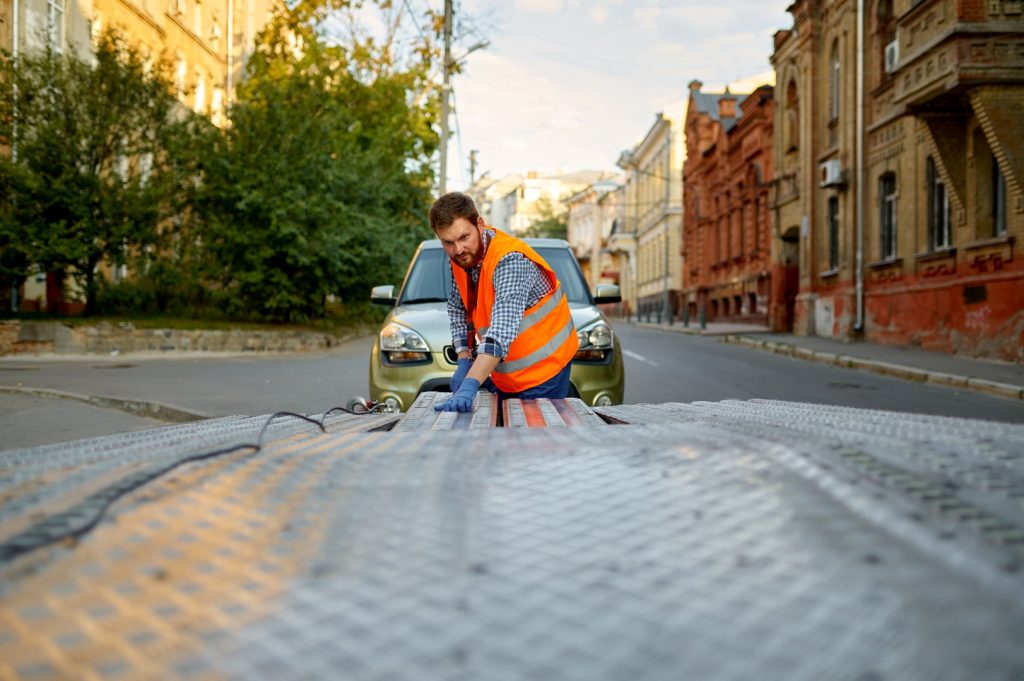 Tow truck operator promptly preparing equipment to deliver fast and reliable towing services.
