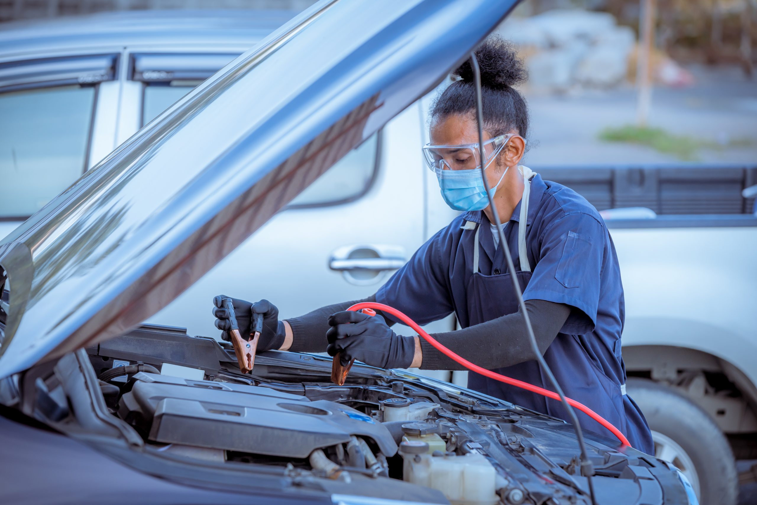 mechanic-opens-car-hood-to-use-the-battery-charger-2023-11-27-05-32-13-utc